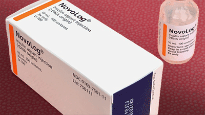 bottle of insulin next to it's packaging box